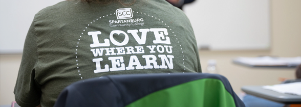Student in classroom with statement 