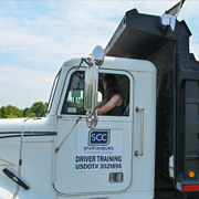 SCC Backhoe truck with student driving