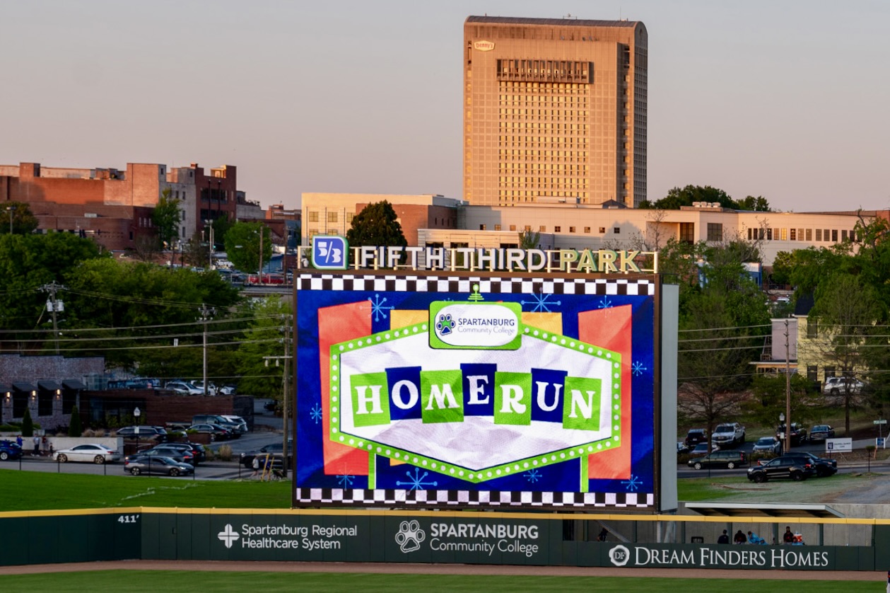 The jumbotron at Fifth Third Park shows a graphic celebrating a home run.