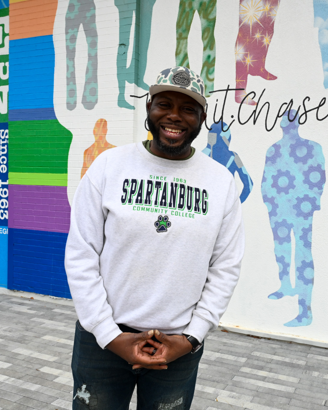 A student smiles and poses at SCC